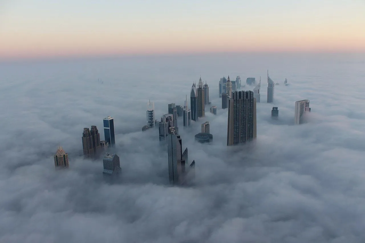 Dubai's towers rising out of morning fog